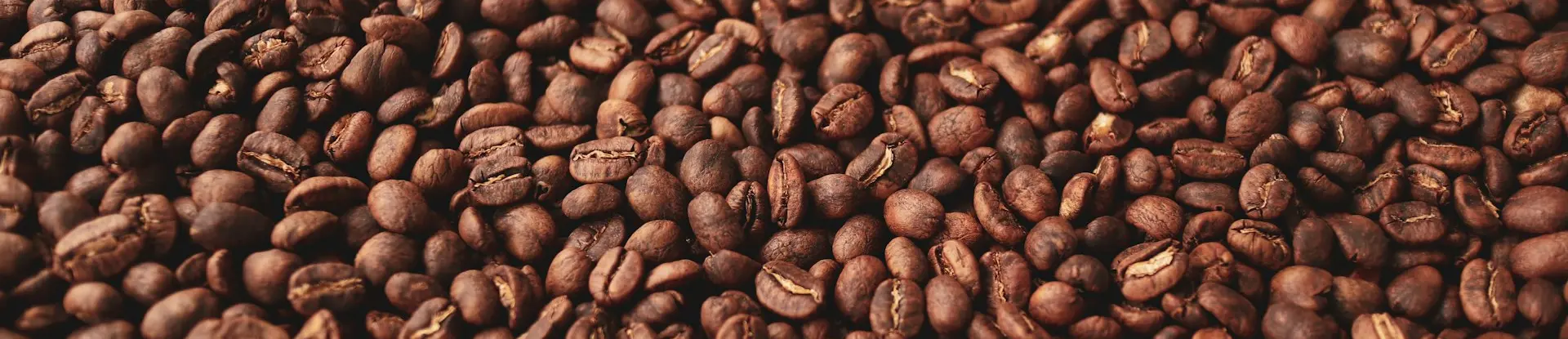 a pile of coffee beans sitting on top of a table
